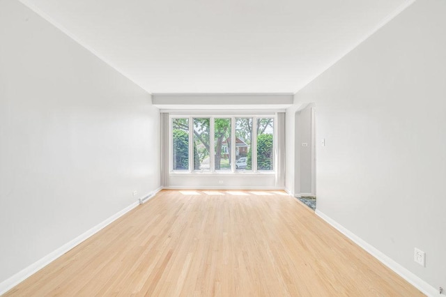 10817 S Kenneth Ave, Oak Lawn, IL 60453 - empty room with light wood finished floors and baseboards