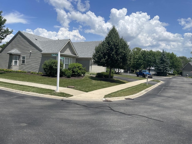 21024 W Walnut Ln, Plainfield, IL 60544 - view of home's exterior featuring a lawn and roof with shingles