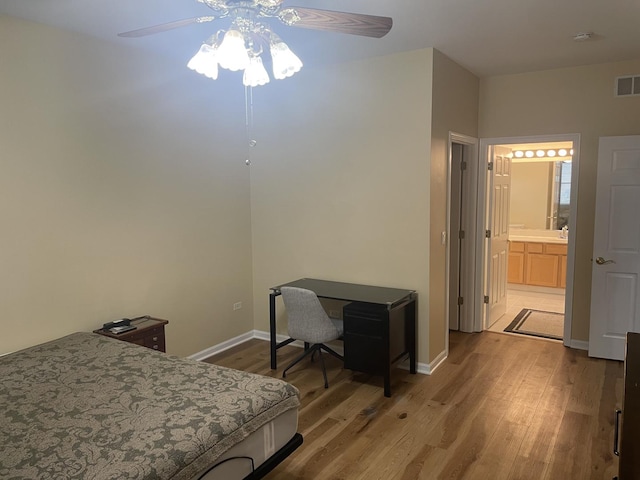 21024 W Walnut Ln, Plainfield, IL 60544 - bedroom with wood finished floors, a ceiling fan, an office area, and ensuite bath