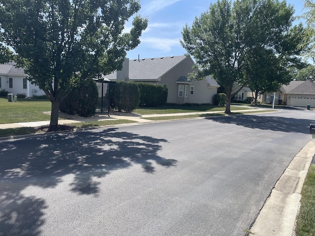21024 W Walnut Ln, Plainfield, IL 60544 - view of asphalt street with sidewalks, curbs, and a residential view