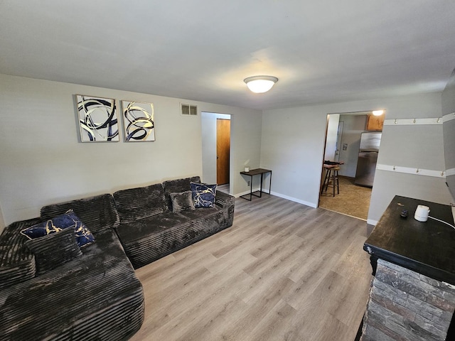 129 S Commonwealth Ave, Elgin, IL 60123 - living room with light wood-type flooring and baseboards