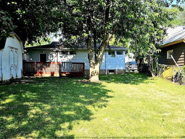 129 S Commonwealth Ave, Elgin, IL 60123 - view of yard with a storage unit and a wooden deck