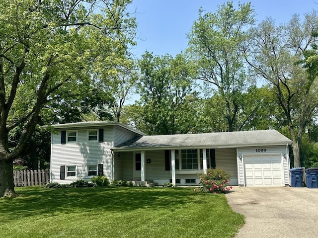 1028 Castlewood Ln, Deerfield, IL 60015 - split level home with an attached garage and driveway
