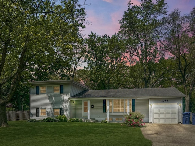 1028 Castlewood Ln, Deerfield, IL 60015 - split level home featuring an attached garage and driveway