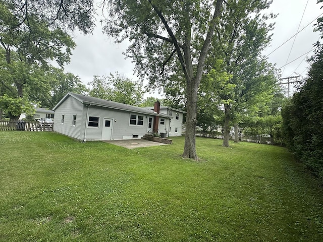 1028 Castlewood Ln, Deerfield, IL 60015 - rear view of house with a chimney and a patio