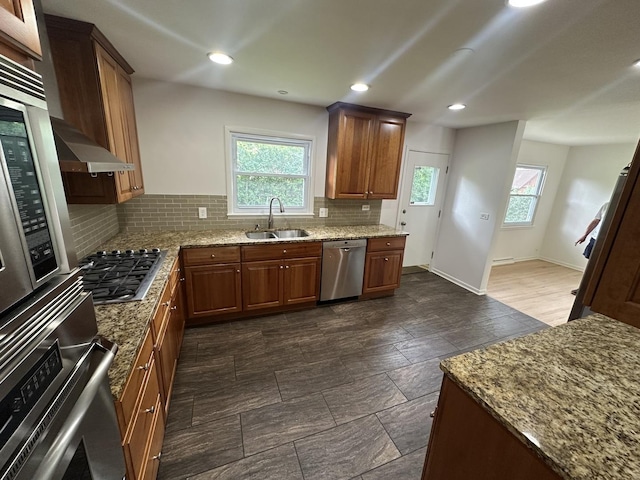 1028 Castlewood Ln, Deerfield, IL 60015 - kitchen with stainless steel appliances, plenty of natural light, backsplash, light stone countertops, and recessed lighting