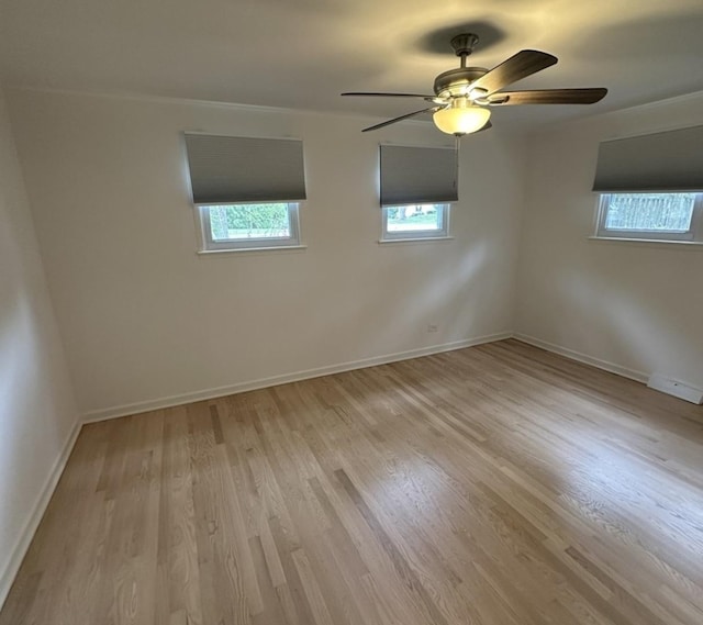 1028 Castlewood Ln, Deerfield, IL 60015 - spare room with light wood-style floors and ceiling fan