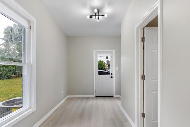 444 Villa St, Elgin, IL 60120 - doorway to outside with light wood-style flooring and baseboards