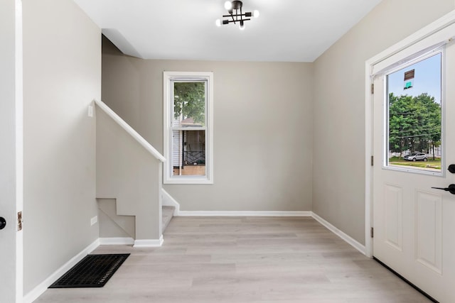 444 Villa St, Elgin, IL 60120 - entrance foyer with plenty of natural light, light wood-style flooring, and stairway