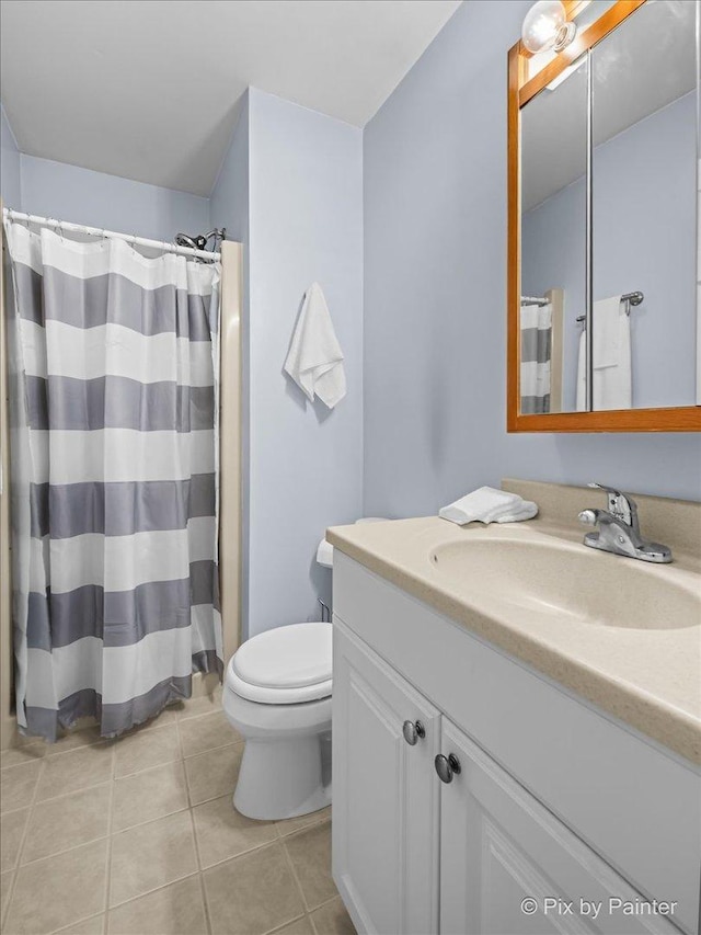 404 Kensington Dr, Mchenry, IL 60050 - full bathroom with vanity, tile patterned floors, and a shower with shower curtain