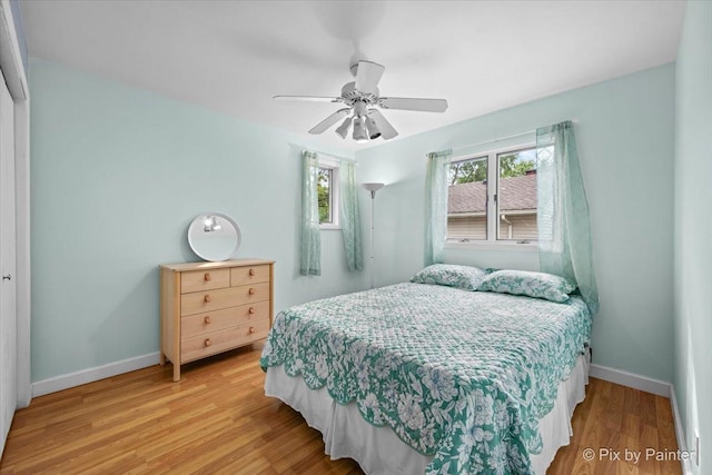 404 Kensington Dr, Mchenry, IL 60050 - bedroom with wood finished floors and a ceiling fan