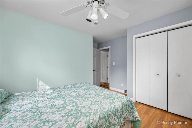 404 Kensington Dr, Mchenry, IL 60050 - bedroom with light wood-type flooring, a closet, and a ceiling fan