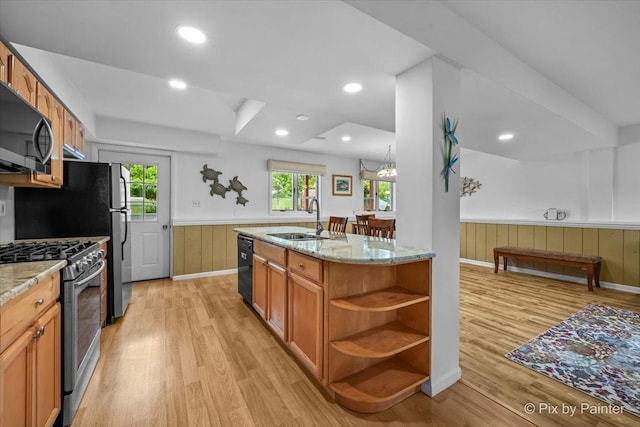 404 Kensington Dr, Mchenry, IL 60050 - kitchen with black appliances, a wainscoted wall, open shelves, light wood-style floors, and light stone counters
