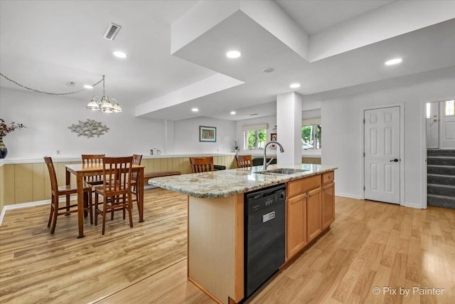 404 Kensington Dr, Mchenry, IL 60050 - kitchen featuring black dishwasher, light wood-style floors, an island with sink, recessed lighting, and light stone counters