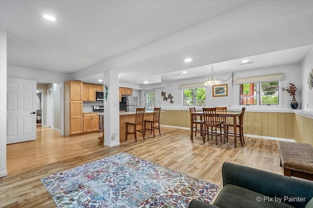 404 Kensington Dr, Mchenry, IL 60050 - living area with light wood finished floors, wainscoting, and recessed lighting