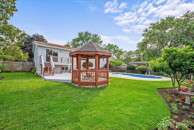 404 Kensington Dr, Mchenry, IL 60050 - rear view of property with a gazebo, a fenced backyard, and a wooden deck