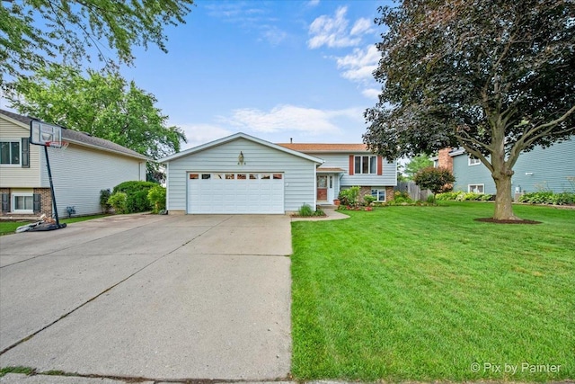 404 Kensington Dr, Mchenry, IL 60050 - tri-level home with a garage, a front lawn, and concrete driveway