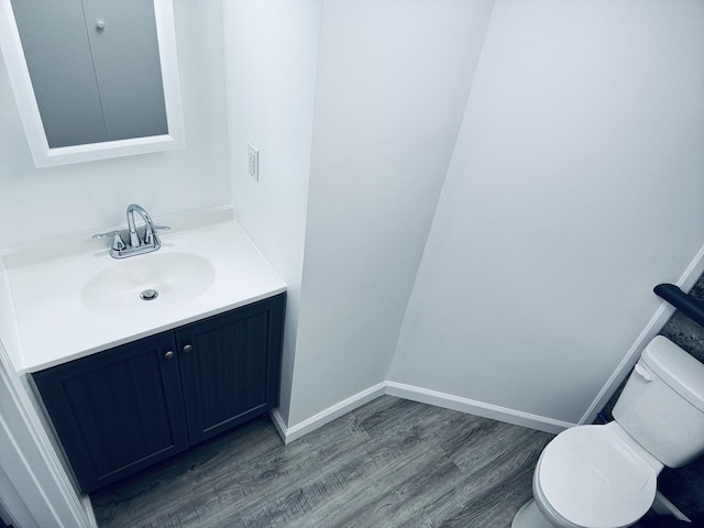 5907 Kirkwood Dr, Rockford, IL 61109 - half bathroom featuring wood finished floors and vanity
