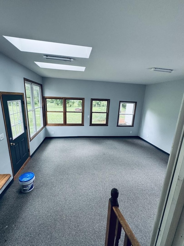 5907 Kirkwood Dr, Rockford, IL 61109 - carpeted spare room featuring a skylight