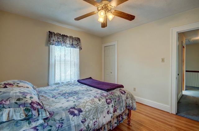 900 Mason Ave, Joliet, IL 60435 - bedroom with wood finished floors, ceiling fan, and a closet