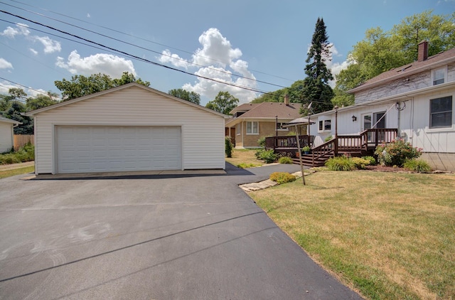 900 Mason Ave, Joliet, IL 60435 - view of front of home featuring a detached garage, an outdoor structure, a deck, and a front lawn
