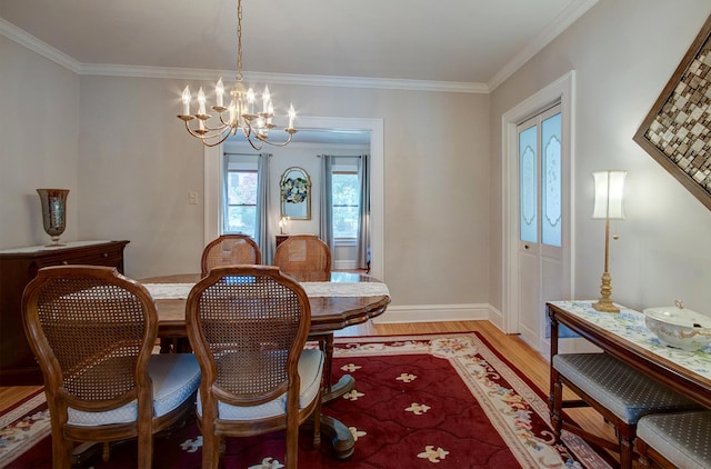 900 Mason Ave, Joliet, IL 60435 - dining space with light wood finished floors, a chandelier, and ornamental molding