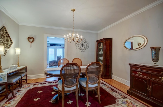 900 Mason Ave, Joliet, IL 60435 - dining space with light wood-style floors, ornamental molding, and a chandelier