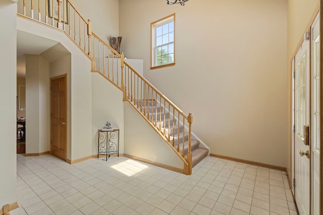 16260 W Mohawk Ct, Lockport, IL 60441 - foyer with tile patterned floors, stairway, and a towering ceiling