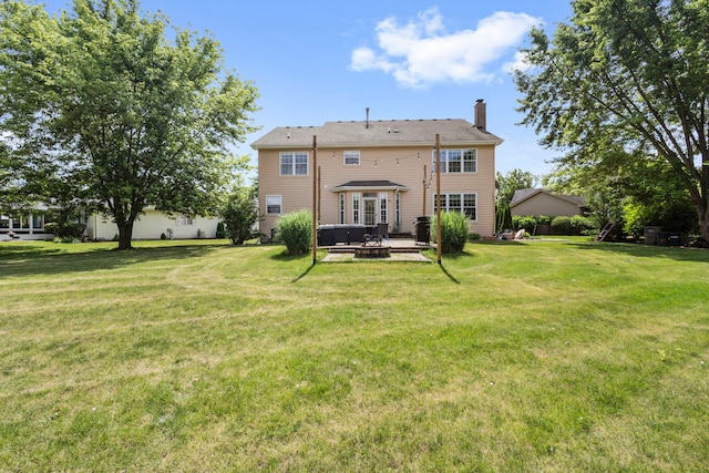 16260 W Mohawk Ct, Lockport, IL 60441 - back of property featuring a chimney, a yard, a fire pit, and a patio
