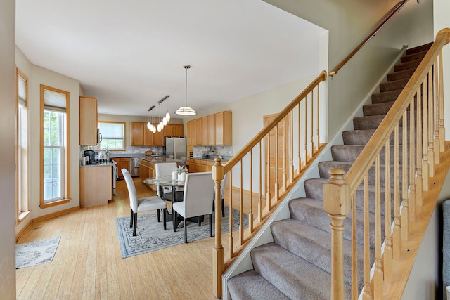 16260 W Mohawk Ct, Lockport, IL 60441 - dining space with light wood finished floors and stairs