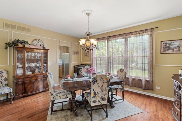 16260 W Mohawk Ct, Lockport, IL 60441 - dining room featuring a chandelier and wood finished floors
