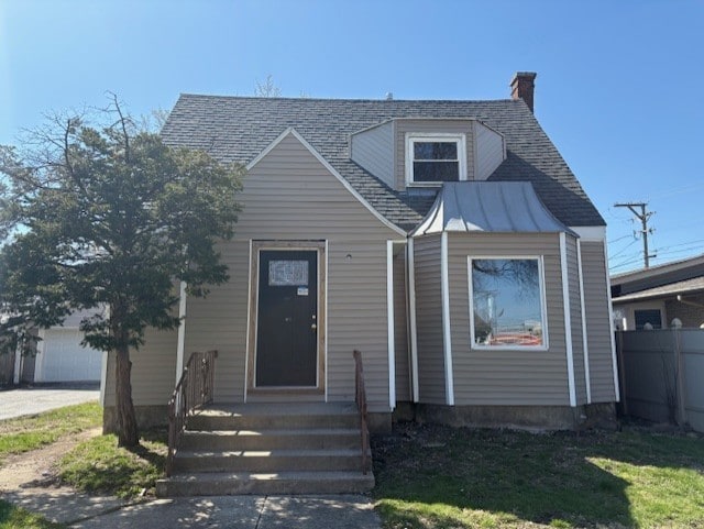 9520 S Sacramento Ave, Evergreen Park, IL 60805 - view of front of property featuring roof with shingles, a chimney, and a garage