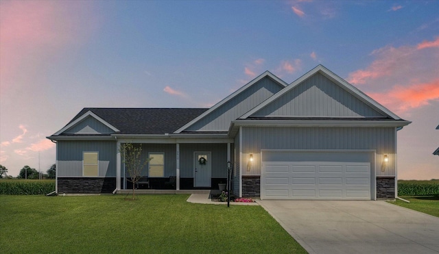 3610 Freedom Blvd, Champaign, IL 61822 - view of front of property featuring stone siding, a front lawn, and driveway