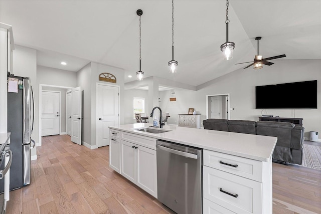 3610 Freedom Blvd, Champaign, IL 61822 - kitchen featuring appliances with stainless steel finishes, open floor plan, light countertops, light wood-type flooring, and lofted ceiling