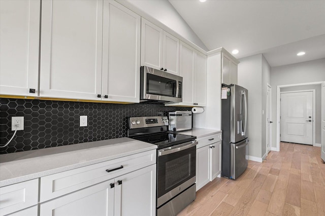3610 Freedom Blvd, Champaign, IL 61822 - kitchen featuring appliances with stainless steel finishes, decorative backsplash, light countertops, recessed lighting, and white cabinetry