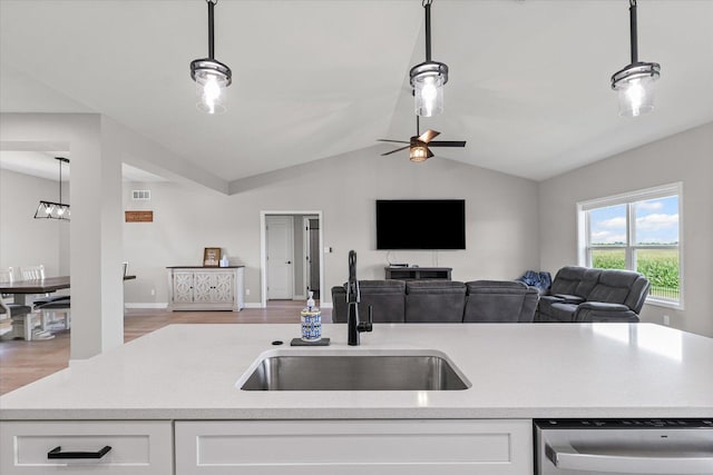 3610 Freedom Blvd, Champaign, IL 61822 - kitchen featuring stainless steel dishwasher, open floor plan, white cabinets, lofted ceiling, and light wood-style floors