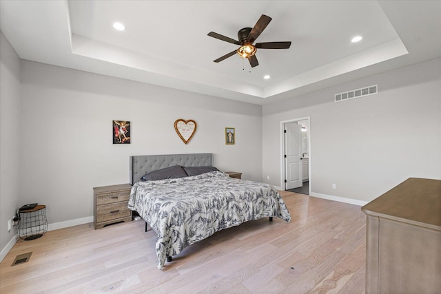 3610 Freedom Blvd, Champaign, IL 61822 - bedroom featuring a tray ceiling, light wood-type flooring, recessed lighting, and a ceiling fan