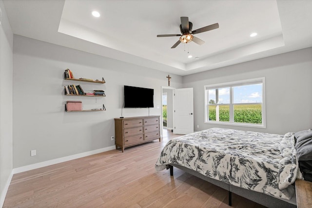 3610 Freedom Blvd, Champaign, IL 61822 - bedroom with a tray ceiling, light wood-type flooring, recessed lighting, and ceiling fan