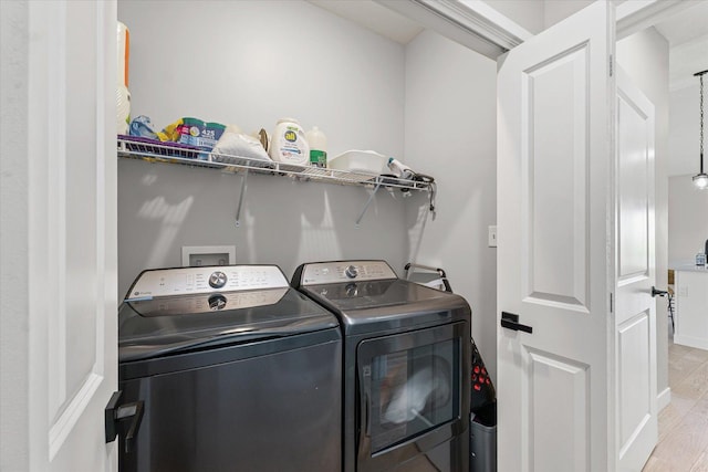 3610 Freedom Blvd, Champaign, IL 61822 - laundry room featuring washing machine and dryer and light wood-style floors