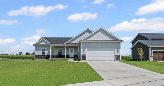 3610 Freedom Blvd, Champaign, IL 61822 - craftsman house with stone siding, a front lawn, a garage, and driveway