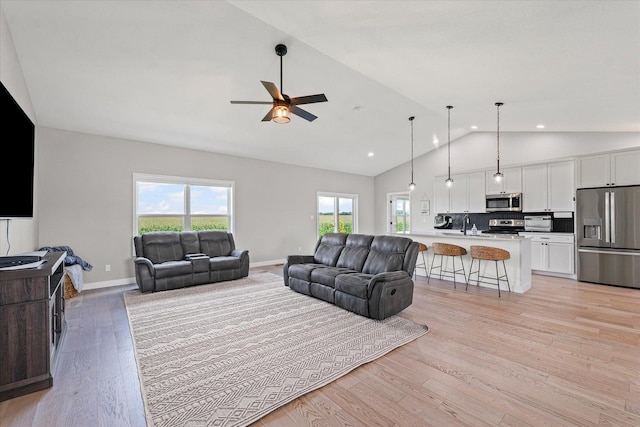3610 Freedom Blvd, Champaign, IL 61822 - living area featuring light wood-style flooring, ceiling fan, high vaulted ceiling, and recessed lighting