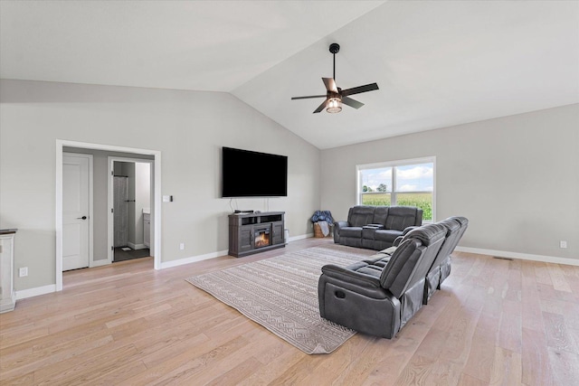 3610 Freedom Blvd, Champaign, IL 61822 - living area featuring ceiling fan, light wood-style flooring, a glass covered fireplace, and high vaulted ceiling