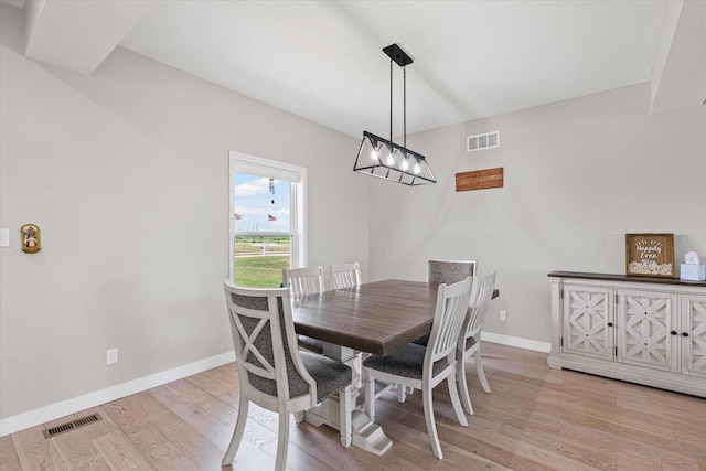 3610 Freedom Blvd, Champaign, IL 61822 - dining area with light wood-style floors and a chandelier