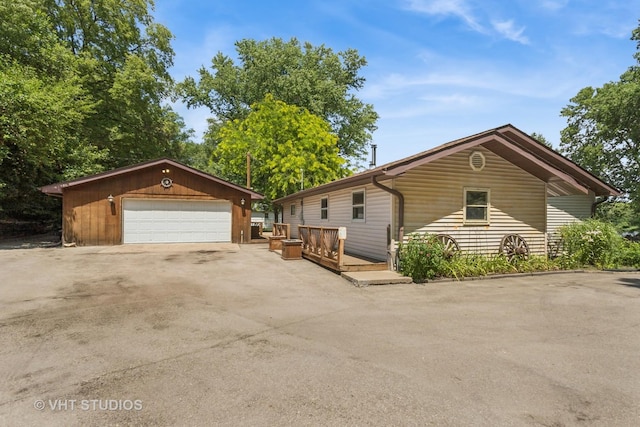 29625 N Readman Ln, Wilmington, IL 60481 - view of front of house with an outbuilding, a detached garage, and a wooden deck