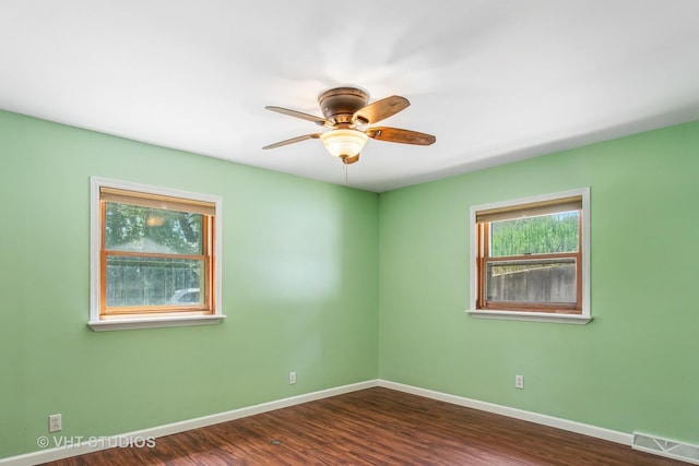 29625 N Readman Ln, Wilmington, IL 60481 - empty room featuring a ceiling fan and dark wood-type flooring