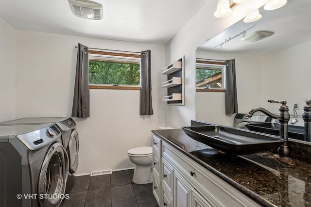 29625 N Readman Ln, Wilmington, IL 60481 - bathroom featuring independent washer and dryer, plenty of natural light, vanity, and tile patterned flooring