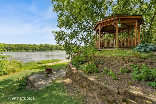 29625 N Readman Ln, Wilmington, IL 60481 - view of green lawn with a gazebo, a water view, and an outdoor fire pit
