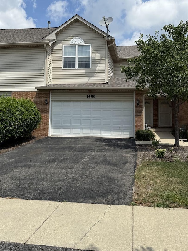 1659 Windward Ct, Naperville, IL 60563 - view of property with brick siding, asphalt driveway, a shingled roof, and an attached garage