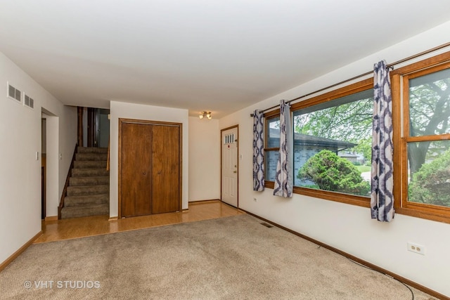 218 Poston Rd, Willow Springs, IL 60480 - carpeted empty room featuring plenty of natural light and stairway