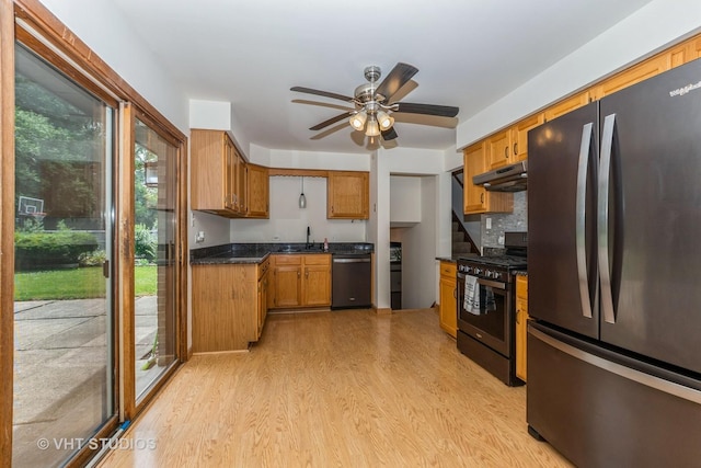 218 Poston Rd, Willow Springs, IL 60480 - kitchen featuring appliances with stainless steel finishes, under cabinet range hood, plenty of natural light, and light wood finished floors